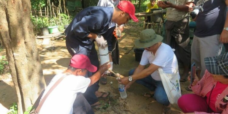 Officials and locals take water samples near Hpa-an. / ALARM Myanmar