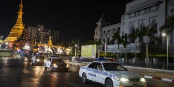 Police carry out a night patrol in Yangon after authorities imposed a curfew on April 19. / Aung Kyaw Htet / The Irrawaddy