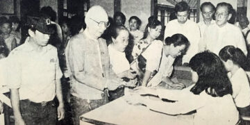 The then-Union Election Commission Chairman U Ba Htay collects a ballot paper before casting his vote on May 27, 1990.