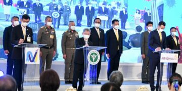 Thai National Vaccine Institute (NVI) director Nakorn Premsri, left, joins Disease Control Department director-general Dr. Opas Kankawinphong, center, and AstraZeneca Thailand president James Teagee at a signing ceremony at Government House to buy COVID vaccines last November.  / Thai Government House / Bangkok Post