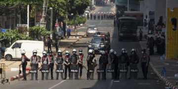 Riot police block the road in Yangon's Myaynigone Junction on Friday, following their crackdown on peaceful anti-regime protesters in which some arrests were made. / The Irrawaddy