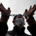 A demonstrator protesting against the arrest of journalists under Article 66(d) of the Telecommunications Law. / Reuters