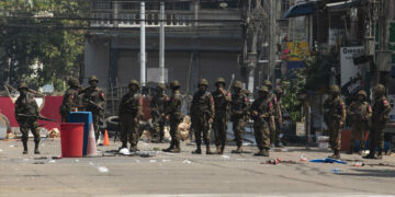 Regime troops in a residential area in Yangon during a crackdown on anti-regime protesters in early March. / The Irrawaddy 