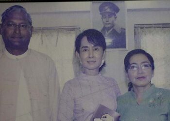 U Ko Ni, left, with Daw Aung San Suu Kyi and his wife in an undated photo taken at the lawyer’s office in Yangon. / Myo Min Soe / The Irrawaddy
