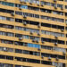Air conditioning units dot the facade of a residential apartment block in Singapore, April 6, 2017. / Reuters