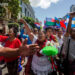 Three convicted Karen activists march in central Yangon with supporters after being released by a township court in October 2019. / Aung Kyaw Htet