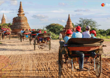 Tourists are seen in horse carts in Bagan. / The Irrawaddy