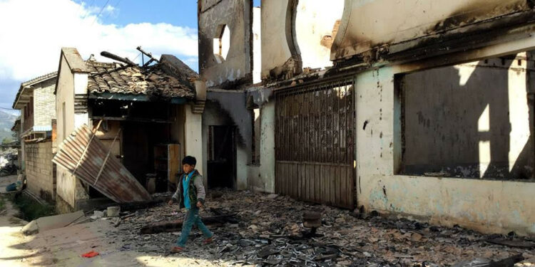 A young boy walks through a damaged building in Mong Ko, Shan State / Nang Seng Non / The Irrawaddy