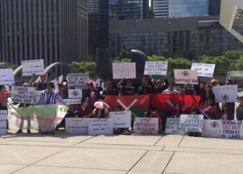 A group, including Karen and Kachin refugees, gather at Toronto City Hall. / Karen Community of Canada.