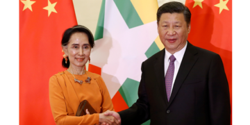 Myanmar State Counselor Daw Aung San Suu Kyi shakes hands with Chinese President Xi Jinping as they meet at the Great Hall of the People in Beijing, China in May 2017. / Reuters