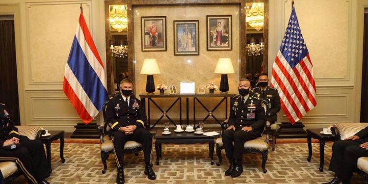 Thai army commander Gen. Apirat Kongsompong (right) meets Gen. James C. McConville, chief of staff of the US army, during the signing ceremony for the Strategic Vision Statement between the Royal Thai Army and US army at RTA headquarters in Bangkok on July 10. / Thai army / Facebook