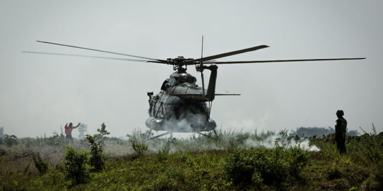 A Burma Air Force helicopter arrives in Maungdaw Township, Arakan State. / Hein Htet / The Irrawaddy