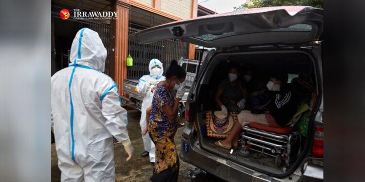 A family in Yangon being sent to a quarantine center after having contact with a COVID-19 patient. / Myo Min Soe