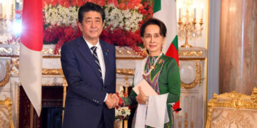 Myanmar State Counselor Daw Aung San Suu Kyi and Japanese Prime Minister Shinzo Abe pose for a photo after their bilateral meeting at the Akasaka Palace in Tokyo on Monday. / Myanmar Ministry of Foreign Affairs / Facebook