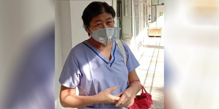 Dr. Myint Myint Sein talks to health care workers at Waibargi Specialist Hospital for Infectious Diseases in Yangon on May 25 after she was discharged from the hospital and before going home. / Facebook
