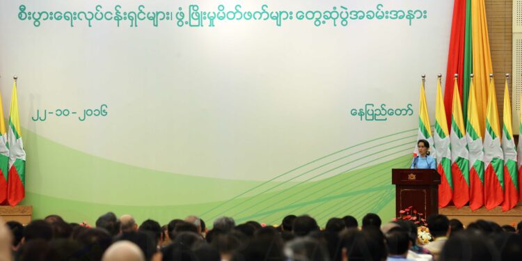 State Counselor Daw Aung San Suu Kyi presents at the meeting with Burma’s business community in Naypyidaw on Saturday / J Paing / The Irrawaddy