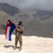 Silverhorn Lermu, an ethnic Karen medic with FBR, holds a Karen flag during his trip to Iraq. / Supplied