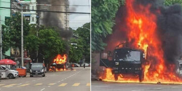 An army truck is engulfed in flames after an explosion in Tamwe Township on Friday.