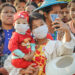 Local residents wait to welcome State Counselor Daw Aung San Suu Kyi ahead of her visit to Depayin, Sagaing Region to hold a public meeting on Wednesday. / Zaw Zaw / The Irrawaddy