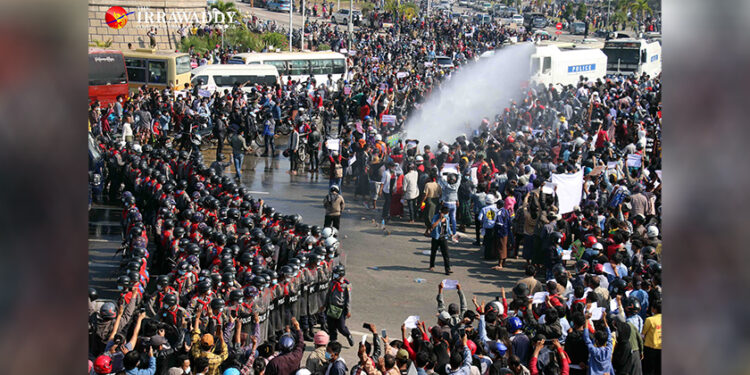 Police use water cannons to disperse anti-coup protesters in Naypyitaw on Monday. / The Irrawaddy