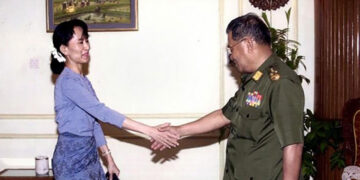 Daw Aung San Suu Kyi and then-junta chief U Than Shwe greet each other at a meeting in 2003 / AFP