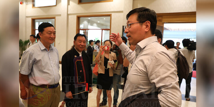 Chinese Ambassador Hong Liang (right) talks to representatives of ethnic armed groups in Naypyitaw on July 10, 2018, shortly before the Panglong Peace Conference. / Myo Min Soe / The Irrawaddy