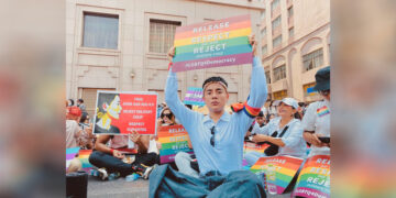 May Oo, a gay celebrity makeup artist, at an anti-regime protest in Yangon in February 2021. / Supplied