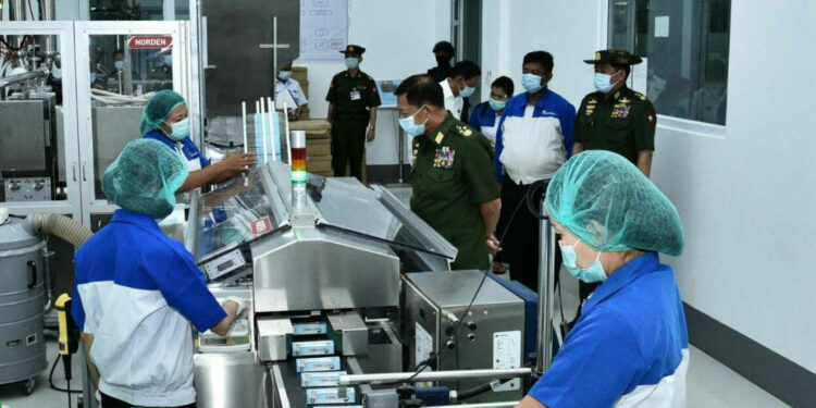 Senior General Min Aung Hlaing's visit to Dentomec toothpaste and toothbrush factory in Yangon in 2020. / Office of the Commander-in-Chief of the Defence Services