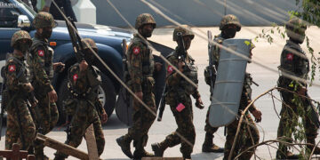 The junta's troops are seen during a crackdown against an anti-regime protest in Yangon in April.