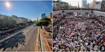 A normally traffic-choked road in downtown Yangon is deserted during Friday’s silent strike, in stark contrast to the tens of thousands of people (at right) who took to the streets in the area to voice opposition to the regime during an earlier protest.