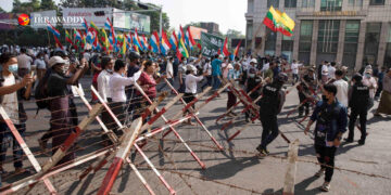 Pro-junta groups stage a counter-demonstration against anti-regime protesters in downtown Yangon in late February. / The Irrawaddy