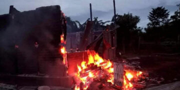 A house burns after junta gunboats opened fire randomly on villages in Kani Township, Sagaing Region in July. / CJ