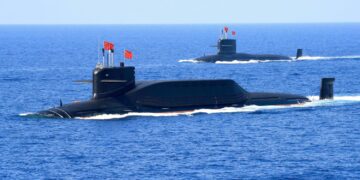 Nuclear-powered Type 094A Jin-class ballistic missile submarines of the Chinese People's Liberation Army Navy in the South China Sea in April 2018. Facing the three AUKUS powers — Australia, the UK and the US — China is projected to enhance its maritime capabilities.  / Reuters via The Bangkok Post