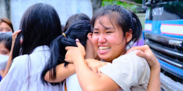 Detainees are seen following their release from Insein Prison in Yangon on Oct. 19 after the regime's mass amnesty on Monday.
