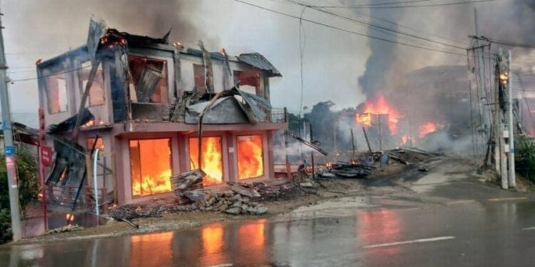 Houses burn after junta forces opened fire on a residential area using heavy weapons and explosives in Thantlang, Chin State on Saturday. / CJ