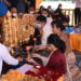 Min Aung Hlaing’s son Aung Pyae Sone (second from right), Aung Pyae Sone’s wife Myo Yadana Htike (third from right) and Min Aung Hlaing’s daughter Khin Thiri Thet Mon (fourth from right) offer a new pennant-shaped vane for the Kyaik Devi pagoda to Dhammasuta Chekinda for consecration on Dec. 18 / Myawady