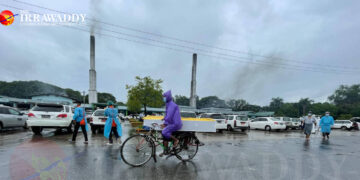 A trishaw carrying a coffin is seen at Yangon’s Yayway Cemetery, as charities providing hearse services are overwhelmed.