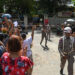 People wait for detainees to be released from Yangon’s Insein Prison on October 19, 2021, after authorities freed thousands of people jailed for protesting against the February 1 coup that ousted the civilian government. / AFP
