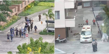 Sixteen people were taken away by junta troops in a raid on the Star City housing complex on Sunday (left). Rescue workers prepare to remove the body of the medic who fell to his death from an apartment during the raid (right).