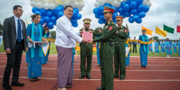 U Tay Za (left) transfers a military sports stadium which was built and donated by his Htoo Group of companies and GDZR company at the Military Technology University in Pyin Oo Lwin Township, Mandalay Region in 2014. / U Tay Za