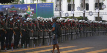 A photojournalist covers a protest in downtown Yangon in the early days of the anti-regime protests in February. / The Irrawaddy