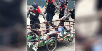Police carry two men hit by bullets in a cart after the deadly crackdown on anti-regime protesters at Mogok, Mandalay Region on April 17. / CJ