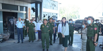Coup leader Snr-Gen Min Aung Hlaing visits a destroyed Chinese-backed factory in Yangon's Hlaing Tharyar Industrial Zone in April. / Commander-in-Chief’s Office