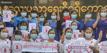 Staff from Mandalay Education Degree College join the civil disobedience movement against the military coup on Friday. / Zaw Zaw / The Irrawaddy