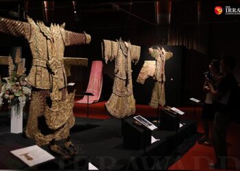 Visitors look at rare, century-old traditional costumes of the Shan Sawbwas at an exhibition at the National Museum in Yangon. / Myo Min Soe