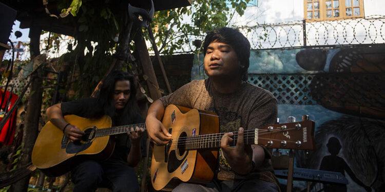 The Peacists perform their latest tracks at a gig to preview their new album, ‘Kyal Kabar Kha Yee Sin’, at the Madnest clothing store in Yangon. / Aung Kyaw Htet