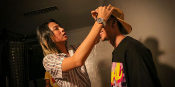 Yoko San styles a local singer for a magazine shoot. / Htet Wai