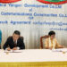 Yangon Region Minister for Electricity, Industry, Transport and Communications Daw Nilar Kyaw, who also serves as chairperson of the New Yangon Development Company (seated at right), and Tang Qiaoliang, president of China Harbor Engineering Company, a subsidiary of CCCC, sign a framework agreement on infrastructure development proposals for the New Yangon City project at the Yangon Regional Government Office’s Mingalar Hall on April 30, 2018. / Yangon Regional Government / Facebook
