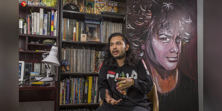 Artist Kyaw Moe Khine (aka Bart Was Not Here) discusses his first solo exhibition, 'God Complex', at his art studio on May 16, 2019. / Htet Wai