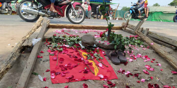 Flowers at the site in Hlaing Tharyar Township, Yangon, on Monday where a man was shot by Myanmar’s security forces while protesting against the military coup.